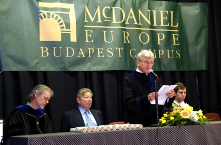 Dean of the Faculty LĂˇszlĂł FrenyĂł addresses the graduating students.